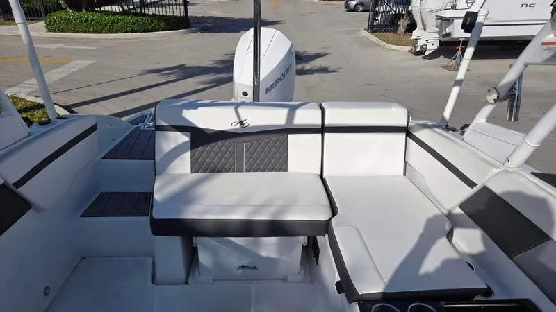 Slide: The Image of 2023 Monterey M225 boat interior with cushioned seating and modern design. - 4