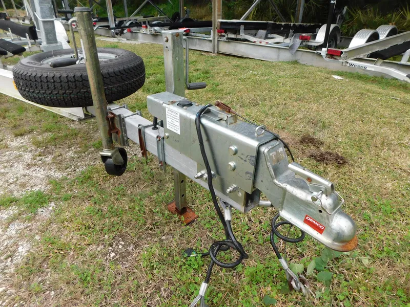 Slide: The Image of Trailer hitch for 2020 Sea Ray SDX 270 Outboard on grassy area. - 19