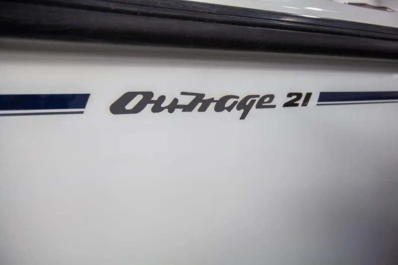 Slide: The Image of Boston Whaler 210 Outrage 2000 model boat nameplate detail. - 14
