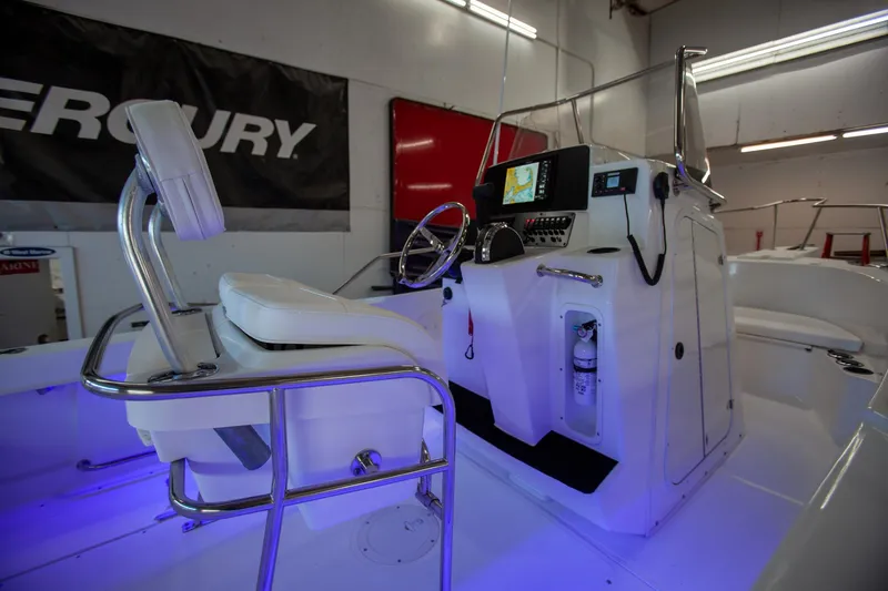 Slide: The Image of Boston Whaler 210 Outrage 2000 model, interior view with steering console and seating. - 16