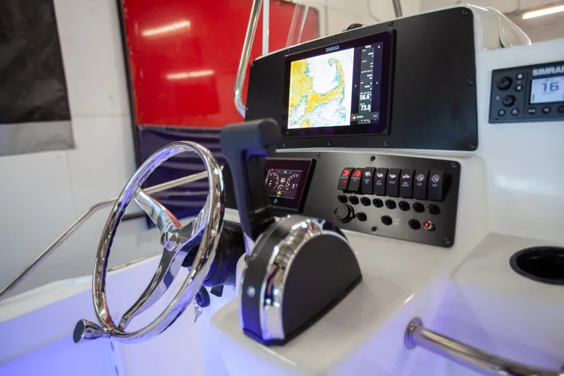 Slide: The Image of Control panel of a 2000 Boston Whaler 210 Outrage boat with navigation equipment. - 17