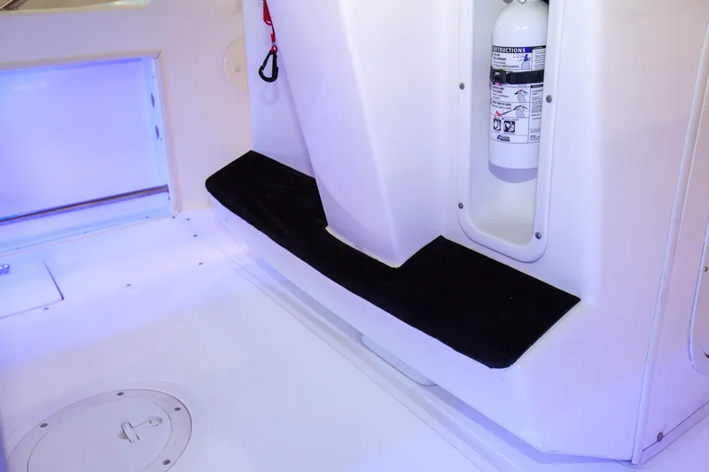 Slide: The Image of Interior of a 2000 Boston Whaler 210 Outrage boat with fire extinguisher. - 18