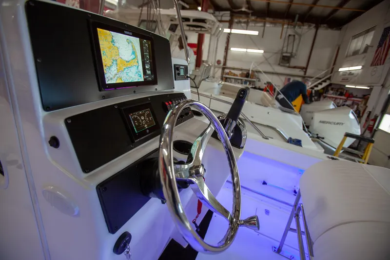 Slide: The Image of Boston Whaler 210 Outrage 2000 boat dashboard with navigation system in a workshop. - 20