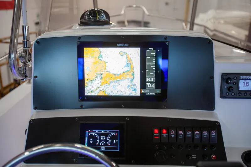 Slide: The Image of Control panel of a 2000 Boston Whaler 210 Outrage boat with navigation display. - 5