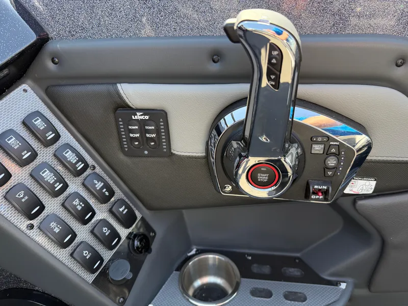 Slide: The Image of Control panel of 2025 Lund 202 Pro-V GL boat with throttle and switches. - 18