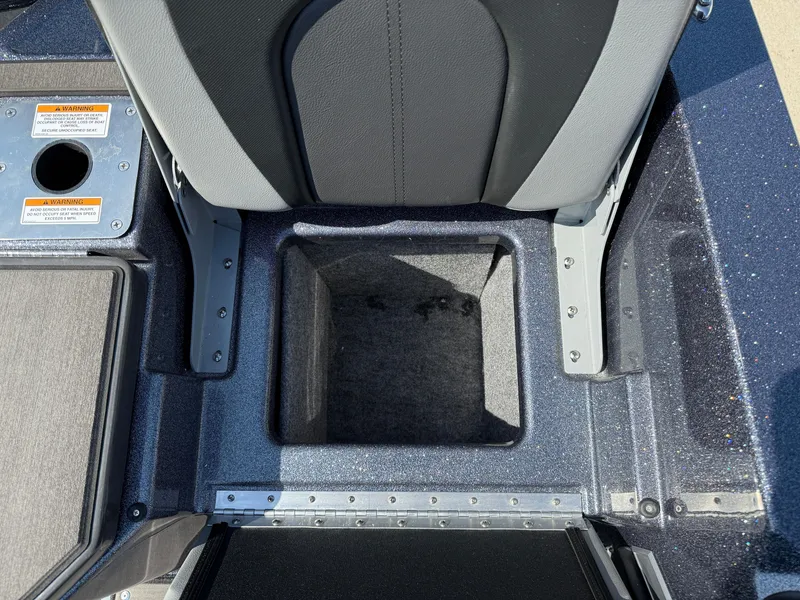 Slide: The Image of 2025 Lund 202 Pro-V GL boat interior storage compartment, featuring durable seating and sleek design. - 30