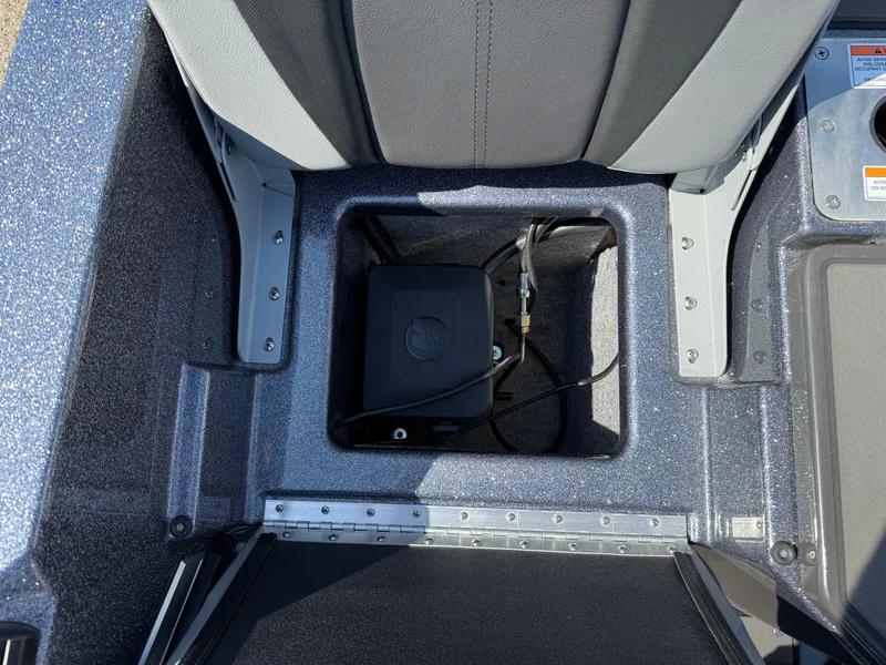 Slide: The Image of 2025 Lund 202 Pro-V GL boat storage compartment with wiring and seating. - 31