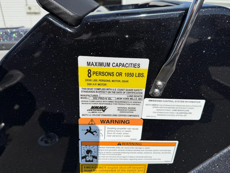 Slide: The Image of 2025 Lund 202 Pro-V GL capacity label, maximum 8 persons or 1050 lbs, safety warnings visible. - 32