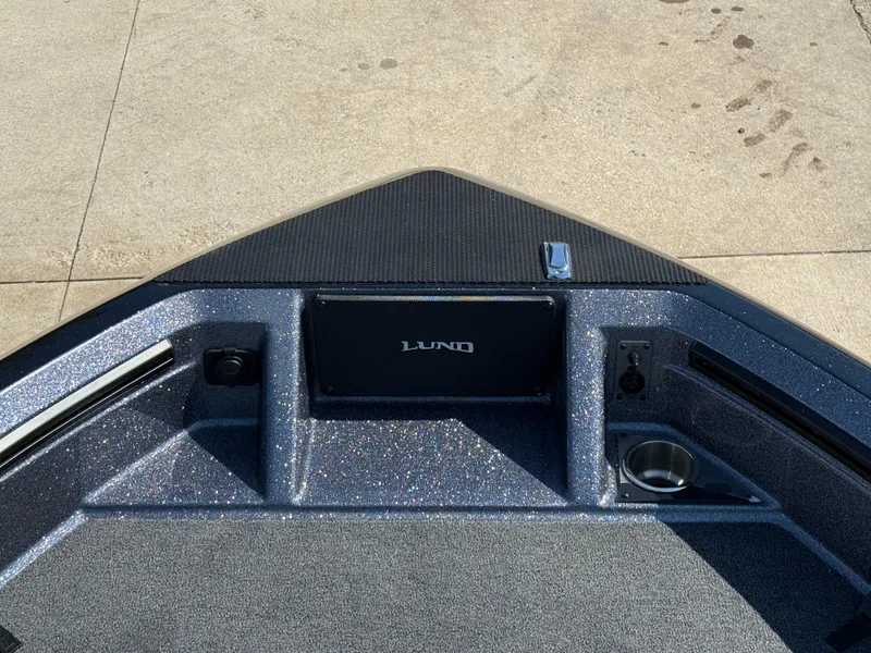 Slide: The Image of 2025 Lund 202 Pro-V GL boat deck with sleek design and modern features. - 4