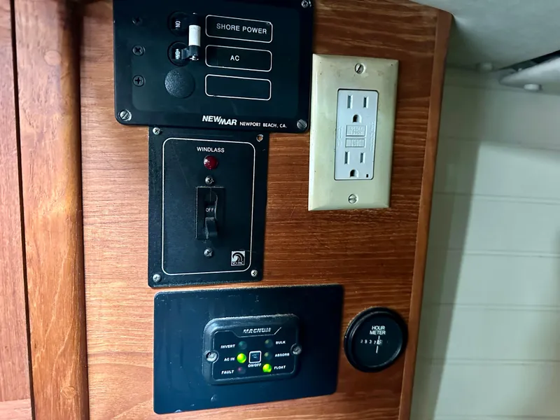 Slide: The Image of Electrical panel on a 1998 Pacific Seacraft Cutter, featuring shore power and AC controls. - 17