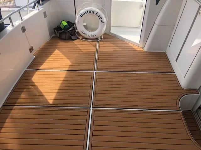 Slide: The Image of 2002 Carver 444 Cockpit Motor Yacht with teak flooring and life preserver. - 14