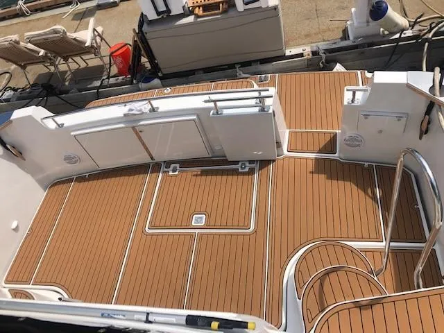 Slide: The Image of 2002 Carver 444 Cockpit Motor Yacht with teak deck, docked at marina. - 15
