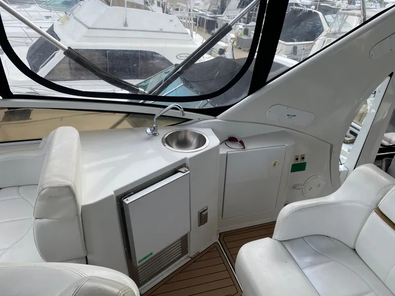 Slide: The Image of Interior of 2002 Carver 444 Cockpit Motor Yacht with sink and seating. - 10