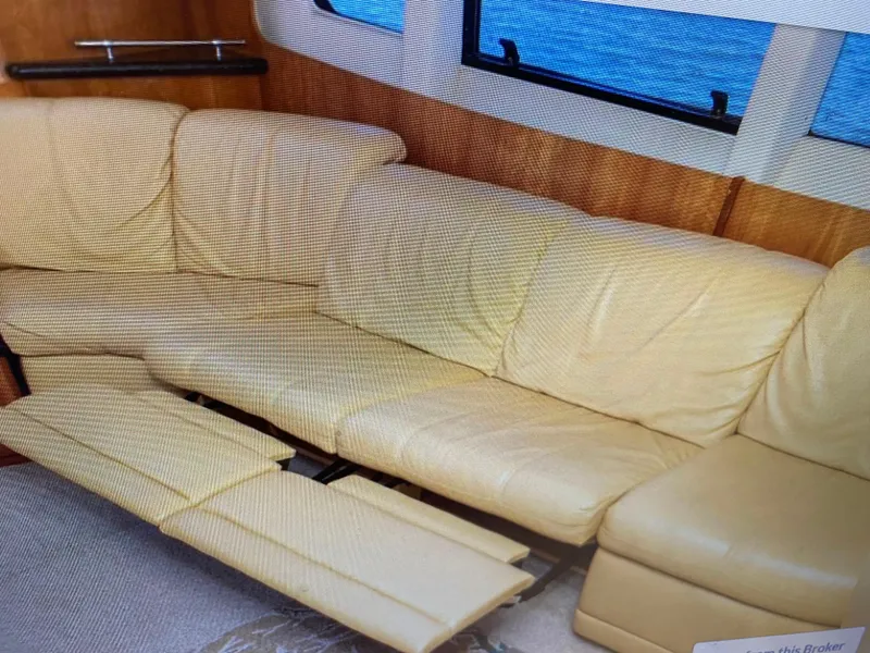 Slide: The Image of Beige leather sofa in 2002 Carver 444 Cockpit Motor Yacht interior. - 21