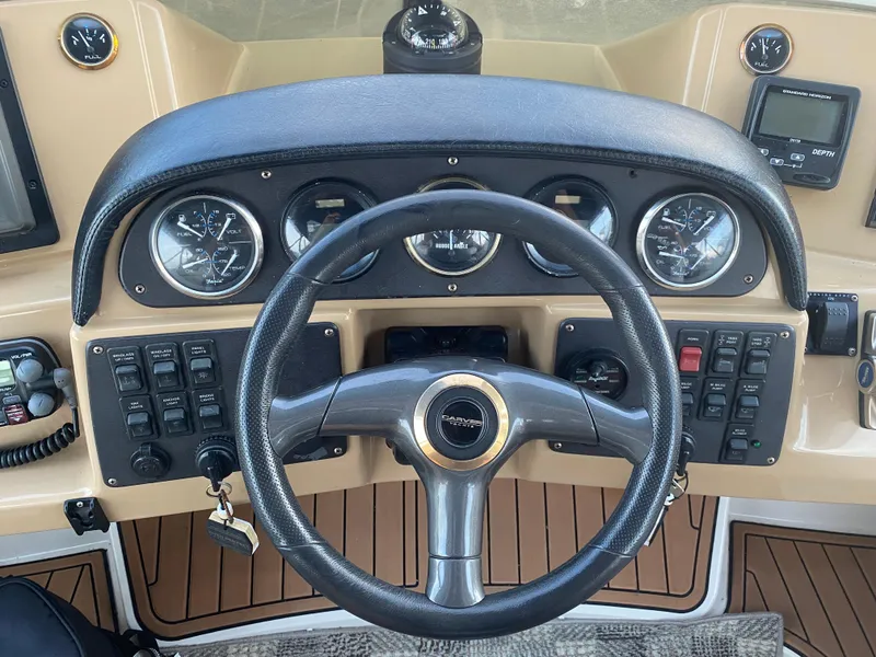 Slide: The Image of Steering wheel and dashboard of 2002 Carver 444 Cockpit Motor Yacht. - 4