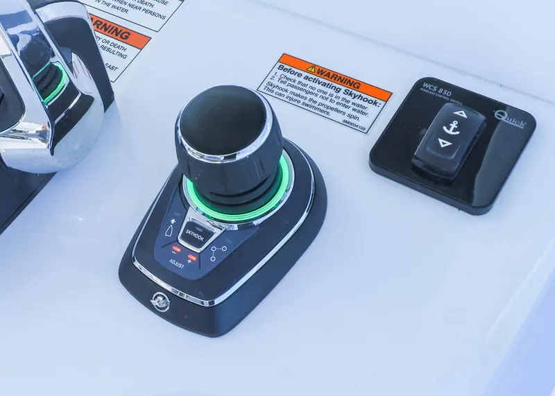 Slide: The Image of Control panel of 2025 Invincible 39 Open Fisherman boat with joystick and anchor button. - 13
