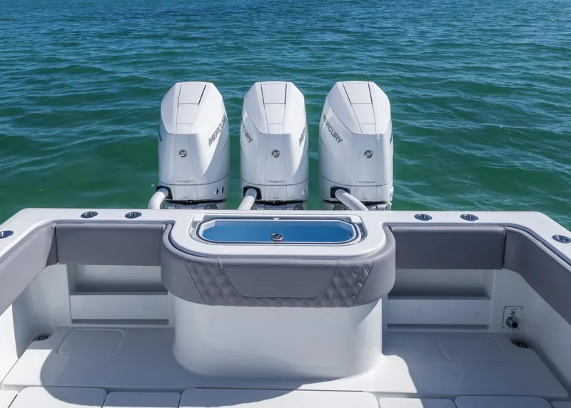 Slide: The Image of 2025 Invincible 39 Open Fisherman with triple outboard engines on the ocean. - 19