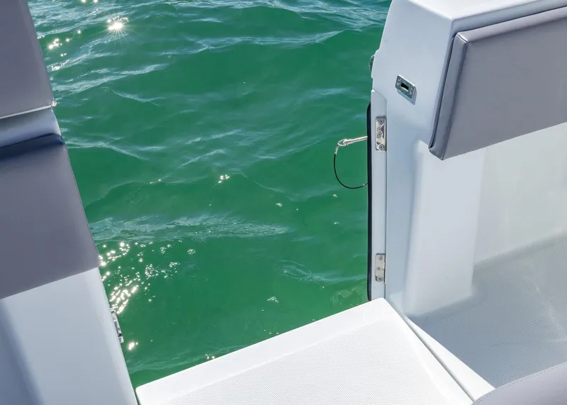 Slide: The Image of 2025 Invincible 39 Open Fisherman boat, open deck view with sparkling water. - 22