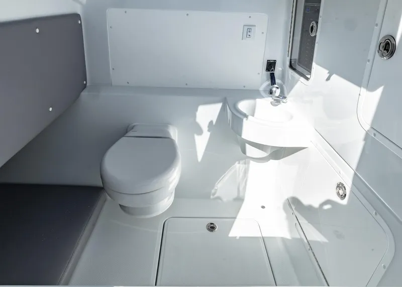 Slide: The Image of 2025 Invincible 39 Open Fisherman boat interior with toilet and sink. - 23