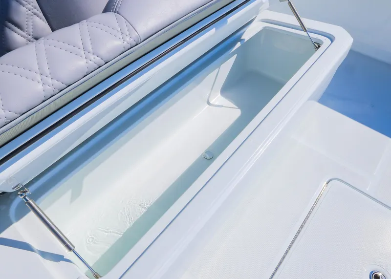 Slide: The Image of 2025 Invincible 39 Open Fisherman boat storage compartment with cushioned seating. - 27