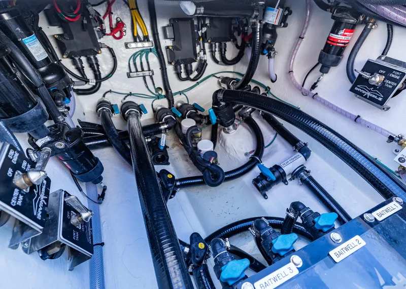 Slide: The Image of Engine compartment of 2025 Invincible 39 Open Fisherman with complex wiring and plumbing. - 34