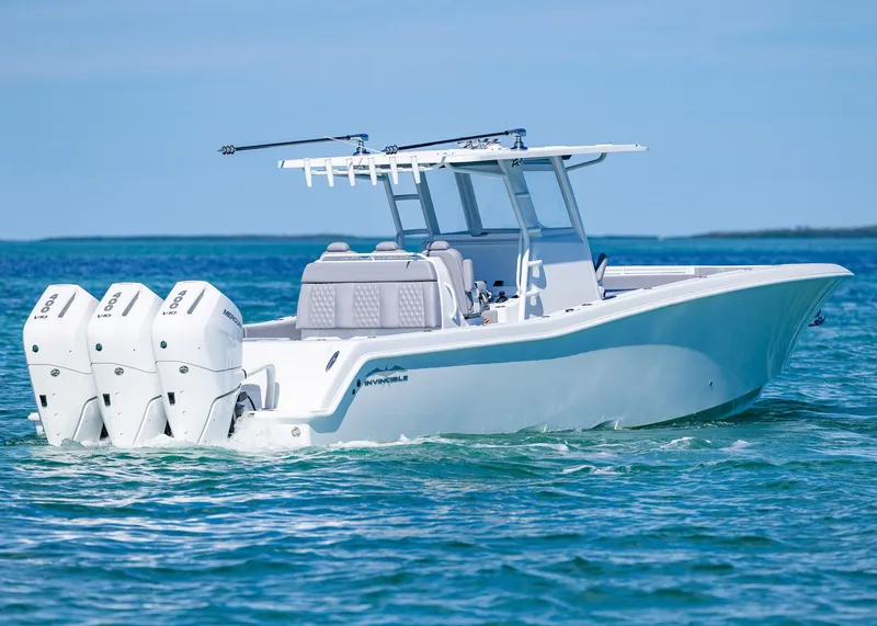 Slide: The Image of 2025 Invincible 39 Open Fisherman boat on clear blue water. - 35