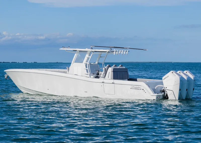 Slide: The Image of 2025 Invincible 39 Open Fisherman boat on calm ocean waters. - 36