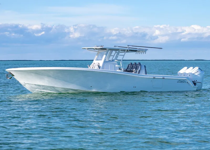 Slide: The Image of 2025 Invincible 39 Open Fisherman boat on calm ocean waters. - 37