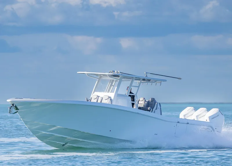 Slide: The Image of 2025 Invincible 39 Open Fisherman boat cruising on calm ocean waters. - 41