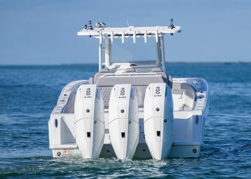 Slide: The Image of 2025 Invincible 39 Open Fisherman boat with triple engines on the ocean. - 6