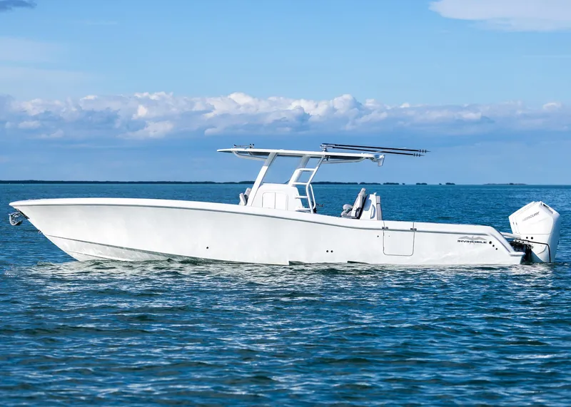 Slide: The Image of 2025 Invincible 39 Open Fisherman boat on calm ocean waters. - 7