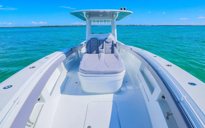 Slide: The Image of 2025 Invincible 39 Open Fisherman boat on clear blue water. - 9