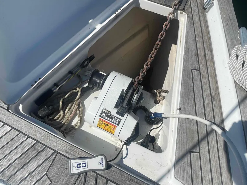 Slide: The Image of Anchor winch compartment on 2004 Beneteau Oceanis 473 sailboat deck. - 30