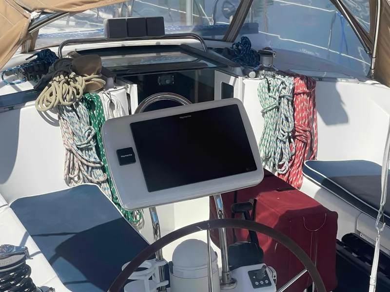 Slide: The Image of Cockpit of 2004 Beneteau Oceanis 473 sailboat with ropes and navigation equipment. - 35