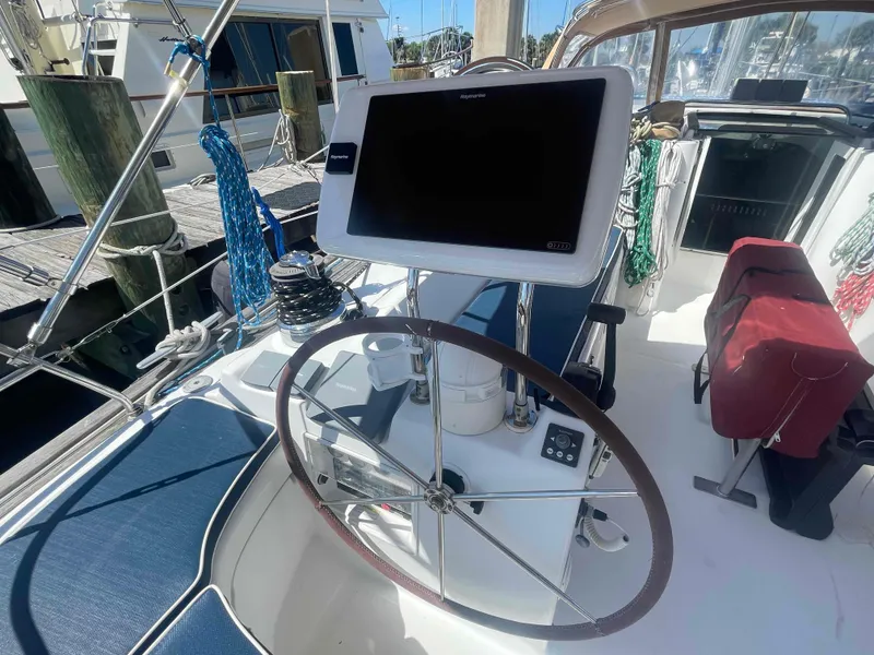 Slide: The Image of Steering wheel and navigation system on a 2004 Beneteau Oceanis 473 sailboat. - 36