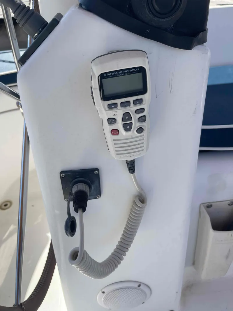 Slide: The Image of VHF radio on 2004 Beneteau Oceanis 473 sailboat cockpit. - 38