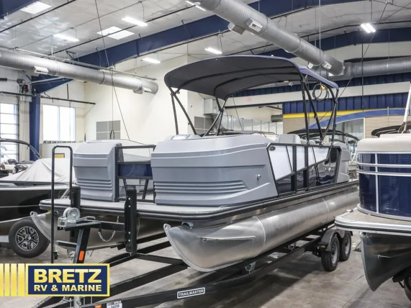 Slide: The Image of Pontoon boat A-22 CLZ DH 2025 model displayed at Bretz RV & Marine showroom. - 4