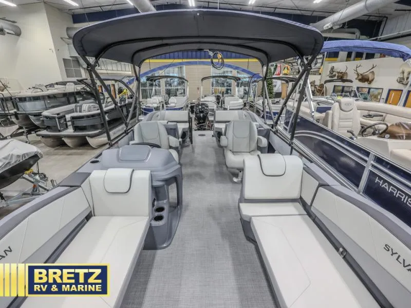 Slide: The Image of 2025 A-22 CLZ DH pontoon boat interior at Bretz RV & Marine showroom. - 5