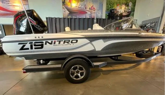 Slide: The Image of 2019 Nitro Z19 Sport boat on trailer in showroom setting. - 0