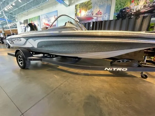 Slide: The Image of 2019 Nitro Z19 Sport boat displayed in a showroom with sleek design. - 1