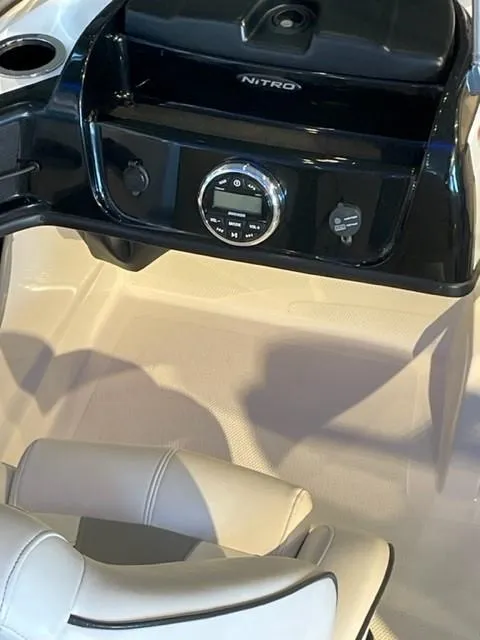 Slide: The Image of 2019 Nitro Z19 Sport boat dashboard with controls and seating. - 8