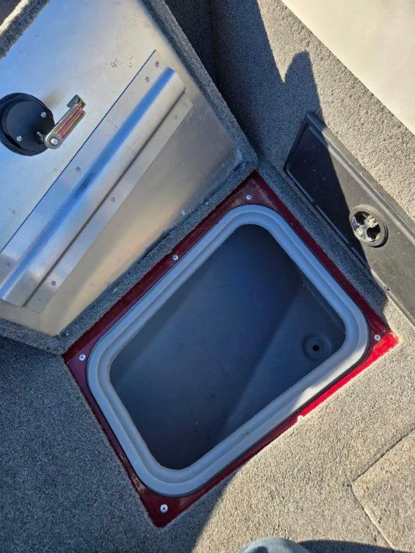 Slide: The Image of Open storage compartment in 2018 Tracker Pro Guide V-175 WT boat. - 11