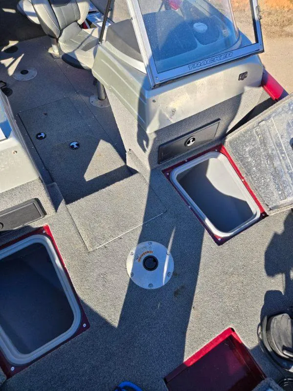 Slide: The Image of 2018 Tracker Pro Guide V-175 WT boat interior with open storage compartments. - 12