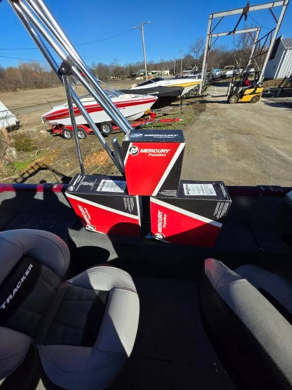 Slide: The Image of 2018 Tracker Pro Guide V-175 WT boat with Mercury boxes on deck, outdoor setting. - 19