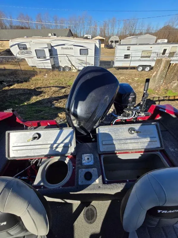 Slide: The Image of 2018 Tracker Pro Guide V-175 WT boat interior with motor, storage compartments, and seating. - 25