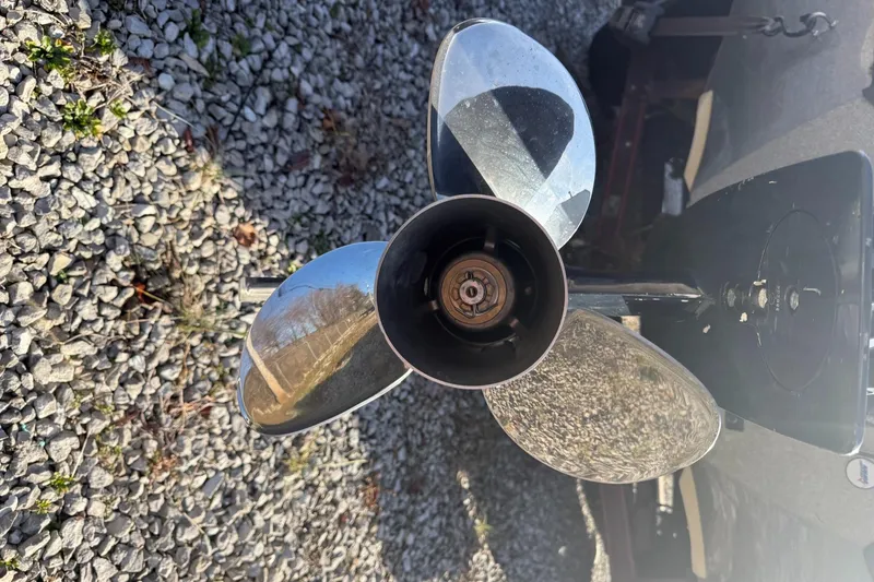 Slide: The Image of Propeller of a 2003 Ranger 521DVX boat on gravel surface. - 10