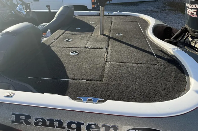 Slide: The Image of 2003 Ranger 521DVX boat deck with storage compartments and seating. - 5