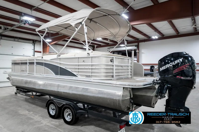 Slide: The Image of 2014 Bennington 2250 RCB pontoon boat with Mercury engine in indoor storage. - 10