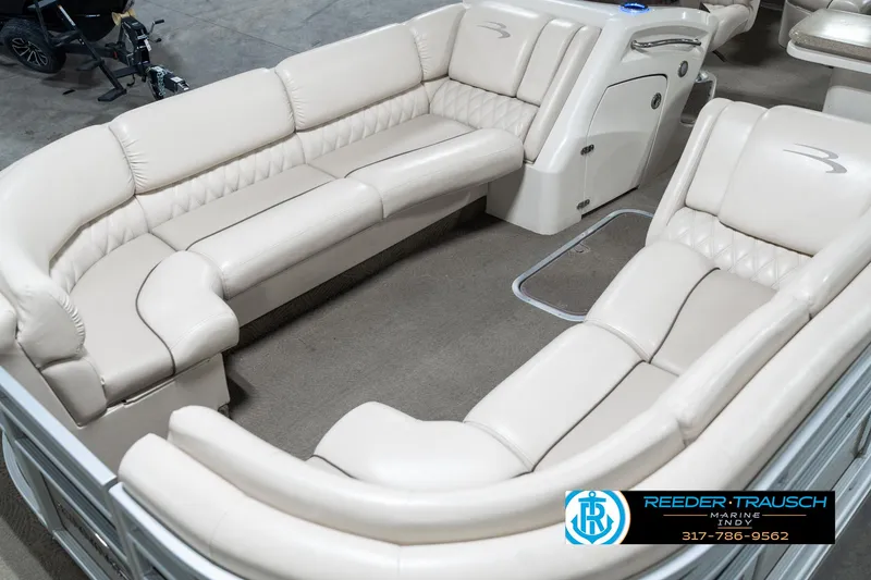 Slide: The Image of 2014 Bennington 2250 RCB pontoon boat with luxurious beige seating and spacious interior. - 12