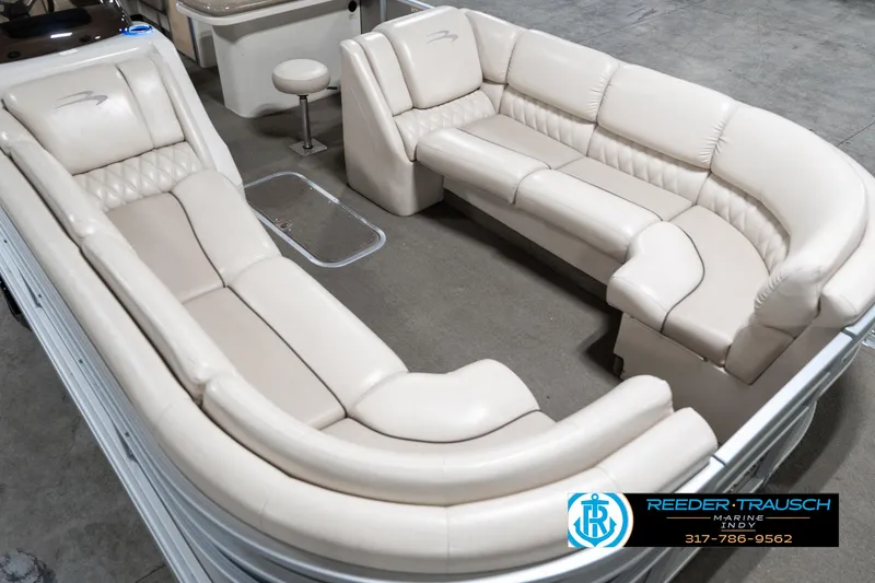 Slide: The Image of 2014 Bennington 2250 RCB pontoon boat interior with beige seating and modern design. - 13